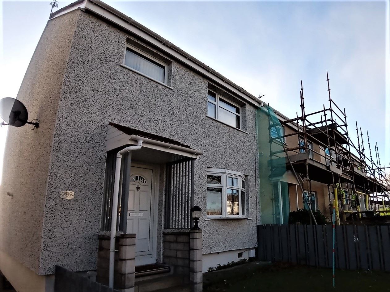long scaffolded wall in house rendering Edinburgh