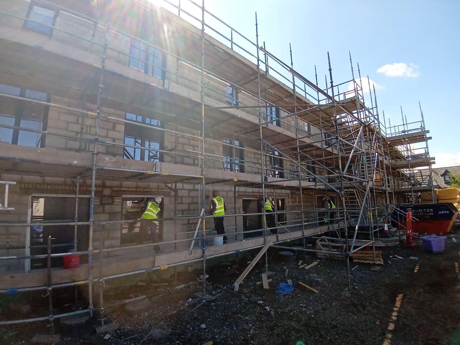 rendering Edinburgh on the side of the house with scaffolding visible