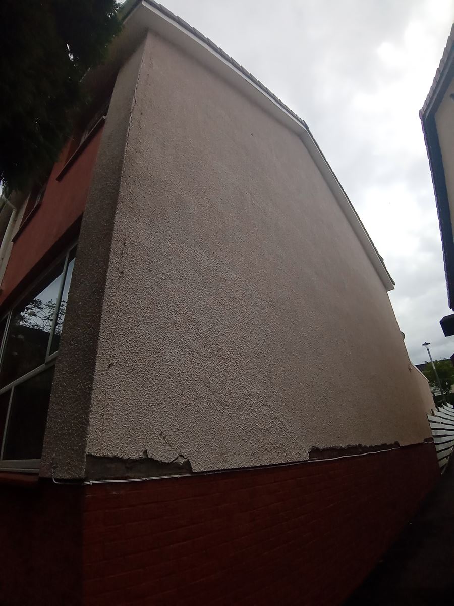 roughcast render Edinburgh on a building corner with visible details