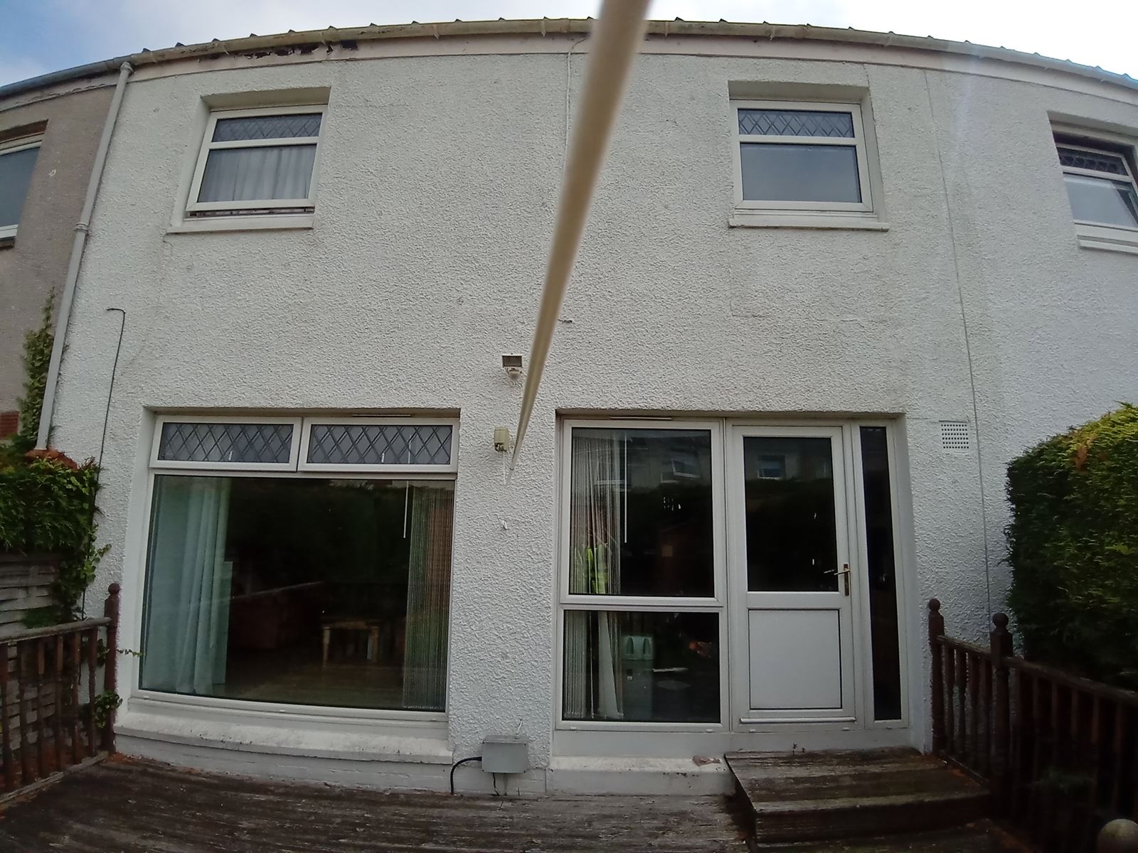 roughcast render Edinburgh on a residential wall with smooth finish
