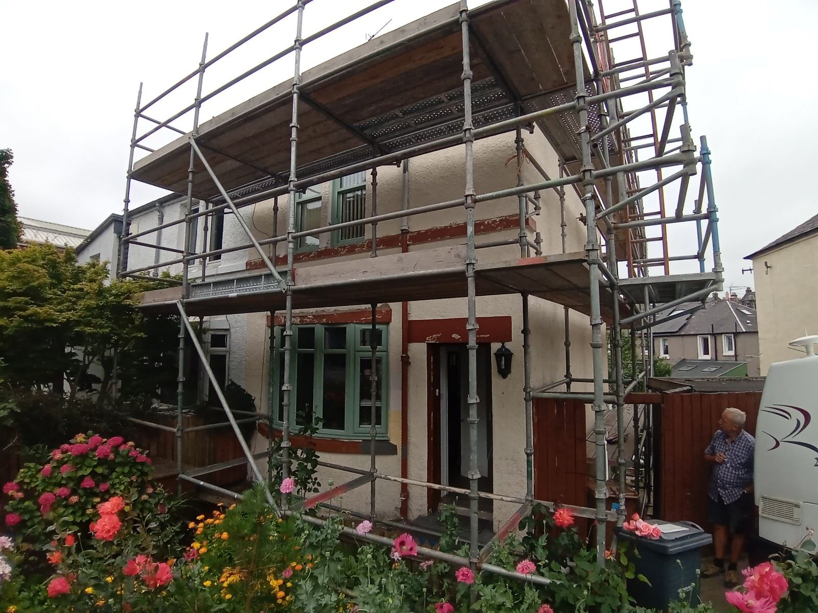 roughcast render Edinburgh applied near windows with scaffolding visible