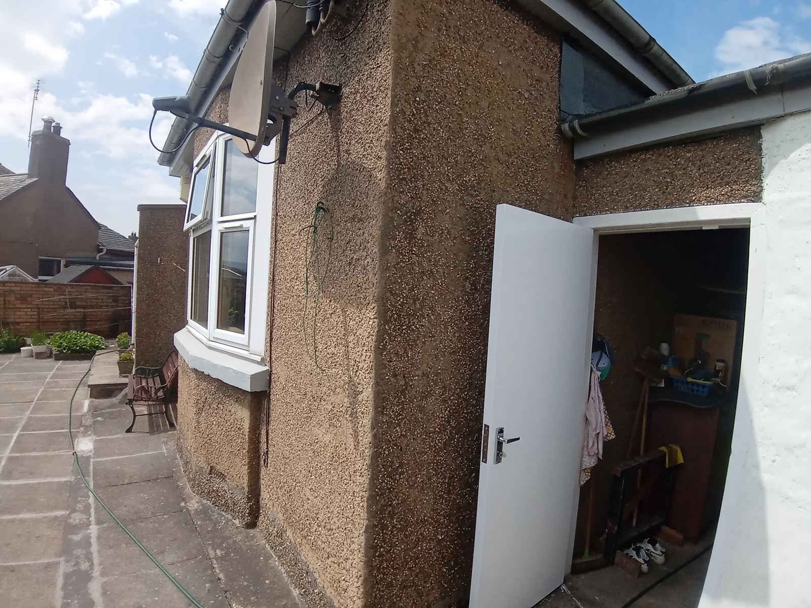 rendering Edinburgh near a door with a newly finished wall