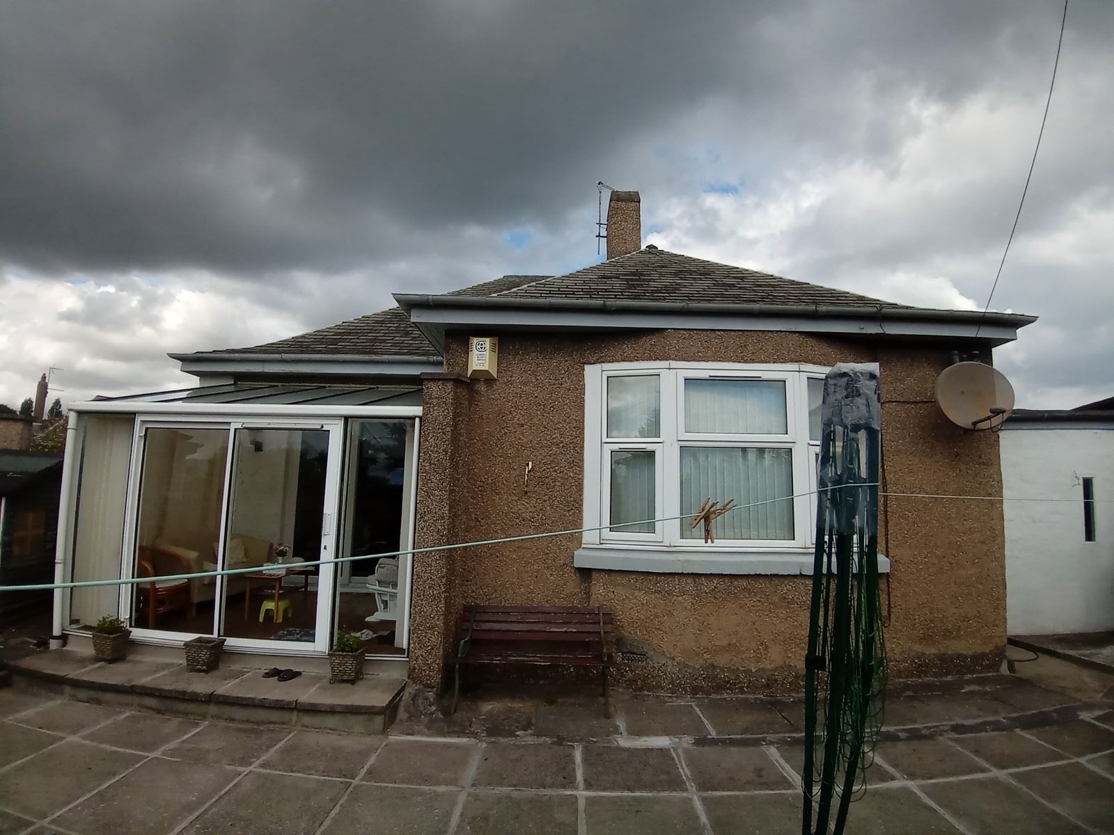 roughcast render applied to the exterior wall with smooth surface