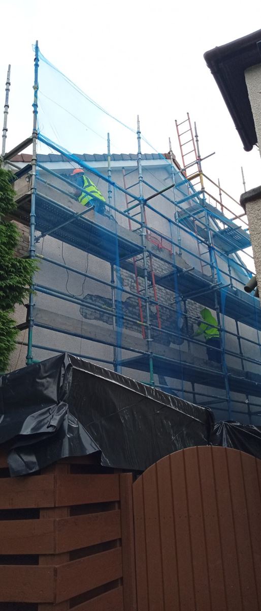 rendering Edinburgh being applied to a building side with scaffolding