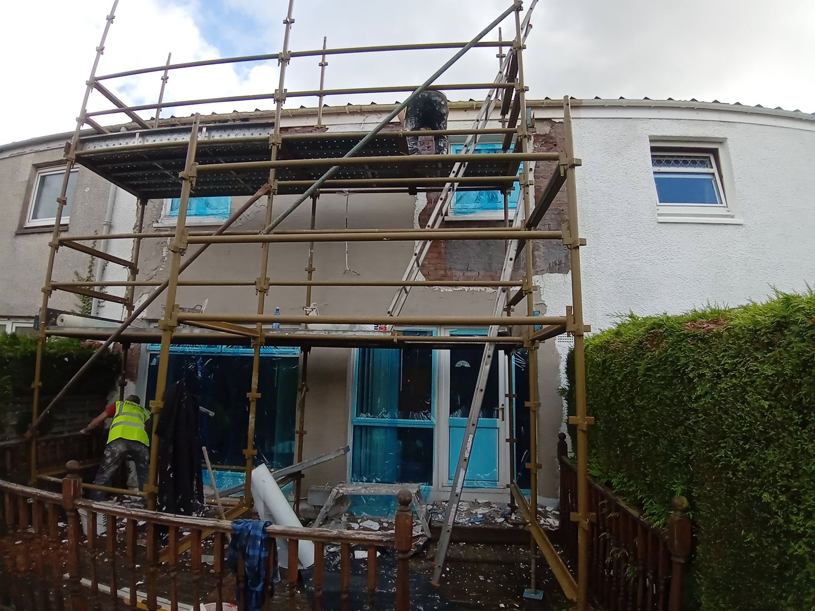 rendering Edinburgh on the building's upper wall with scaffolding in place