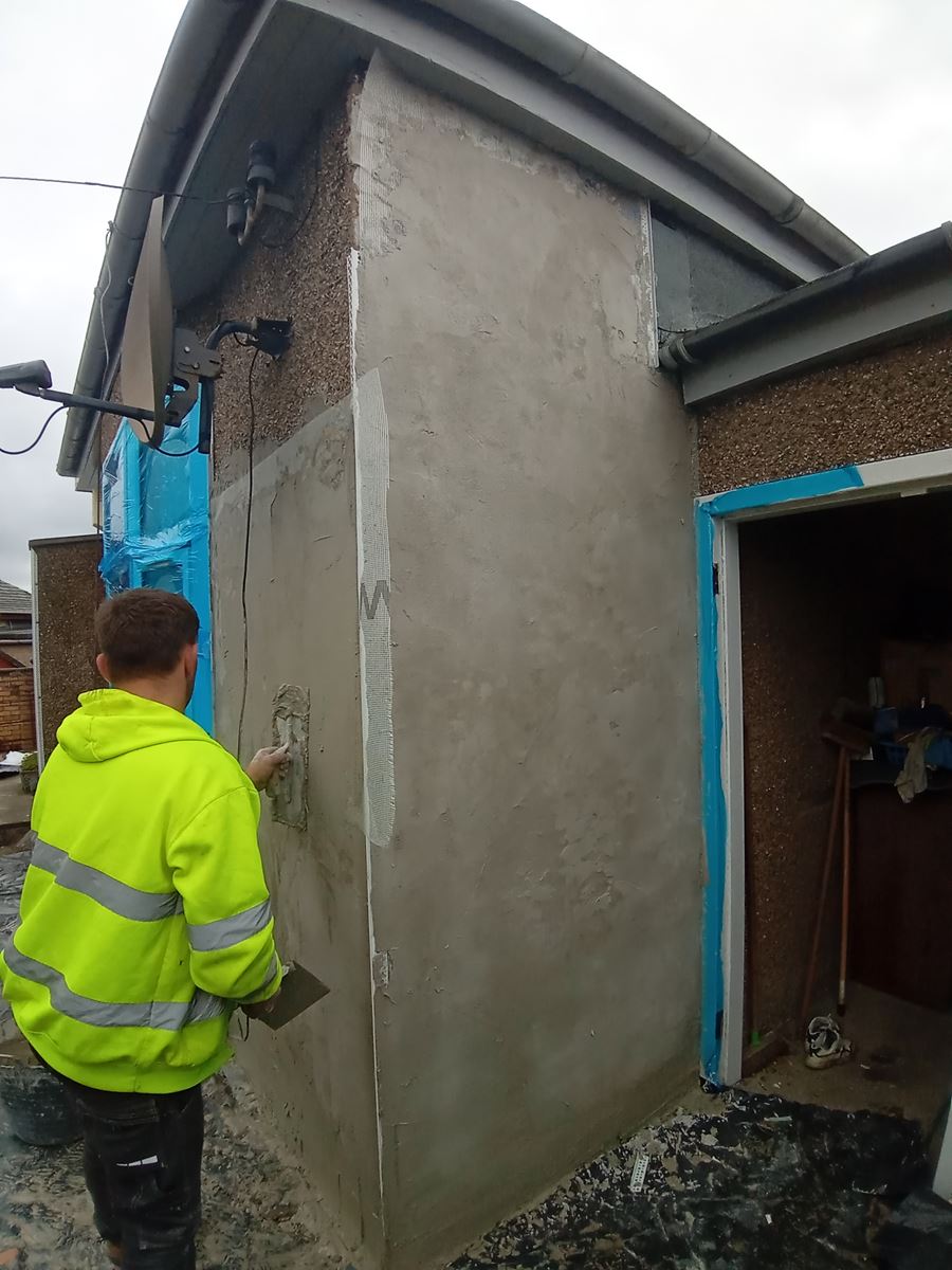 rendering Edinburgh on the exterior wall of the house near the door
