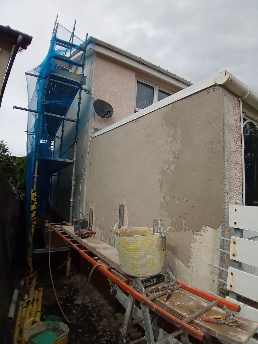 roughcast render Edinburgh applied to the side wall with scaffolding in place