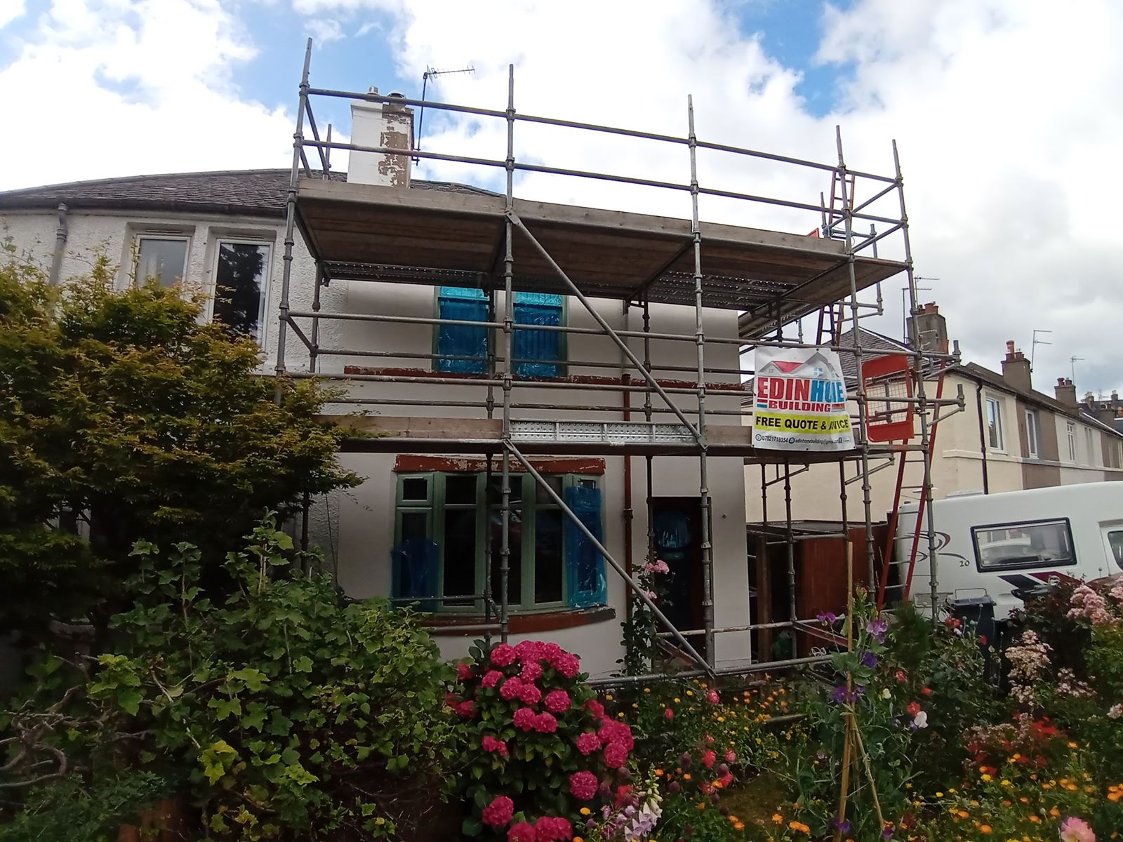 house rendering Edinburgh on the exterior with scaffolding around