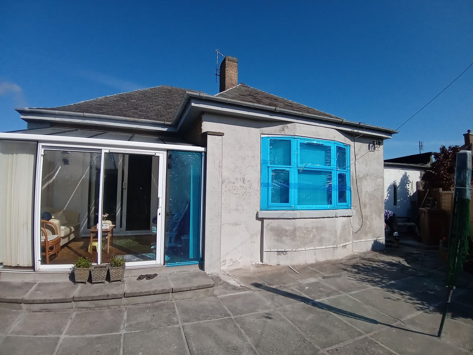 roughcast render Edinburgh applied on the exterior wall near the window