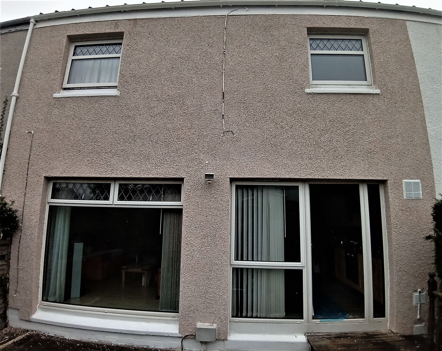 roughcast render Edinburgh on a house wall near the window