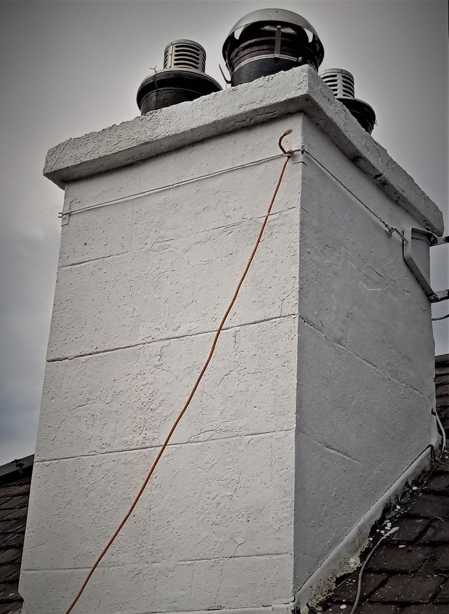 roughcast render Edinburgh on the upper part of a building