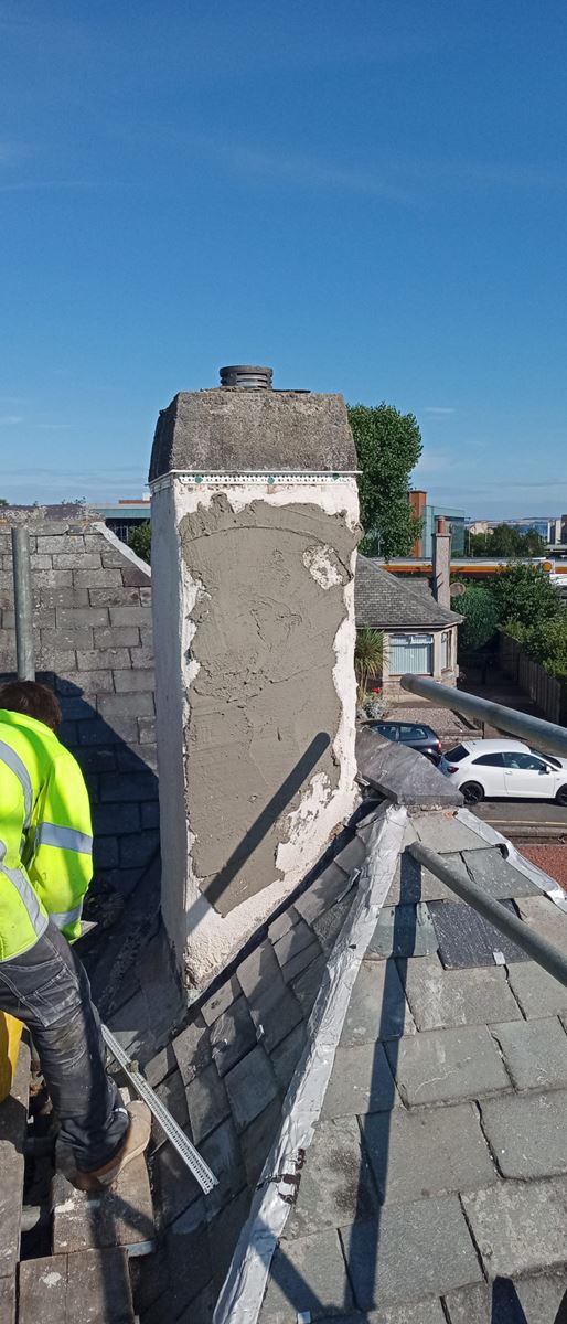 roughcast render Edinburgh on a chimney structure with scaffolding