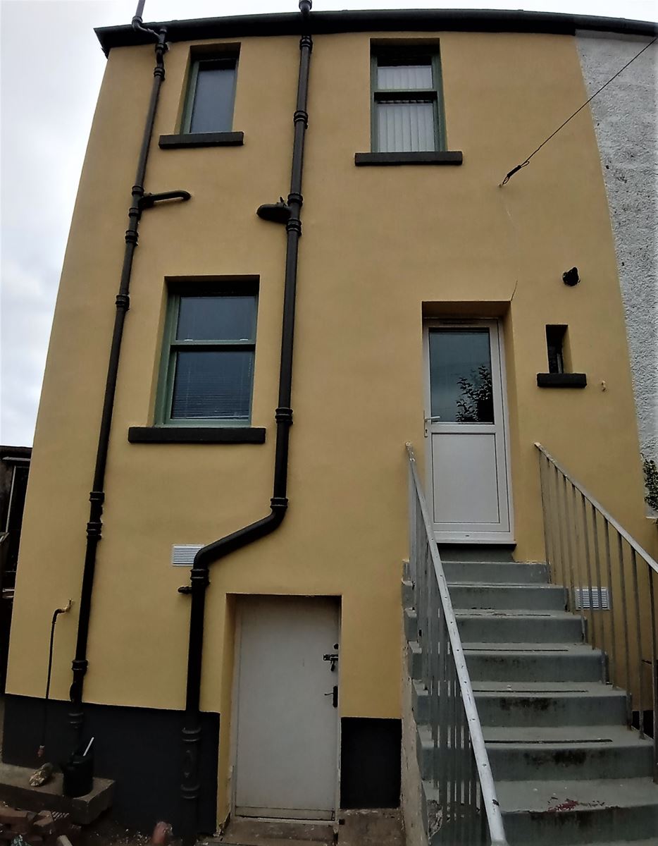 house rendering Edinburgh with a newly applied yellow finish