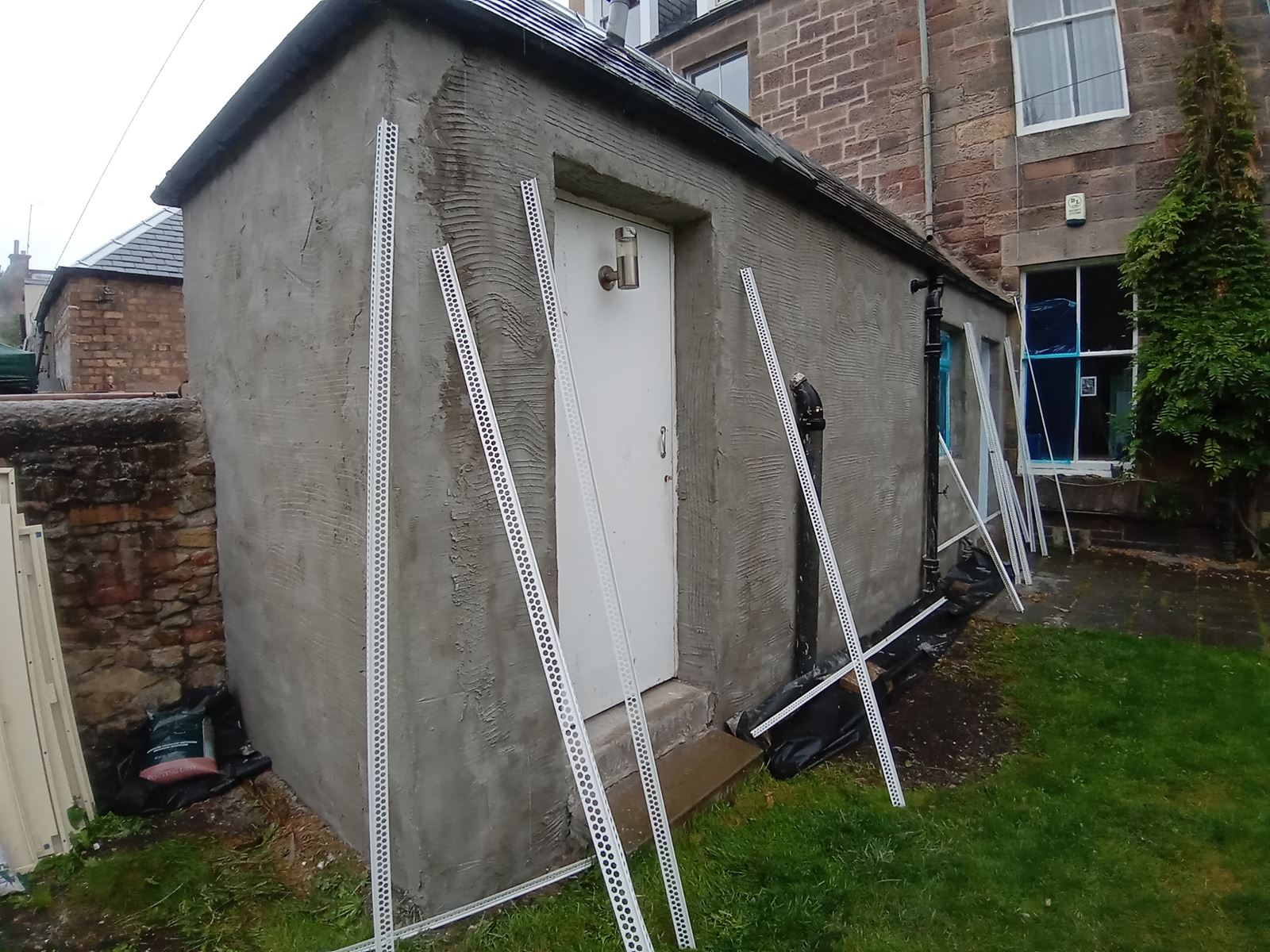 roughcast render Edinburgh applied near garden area