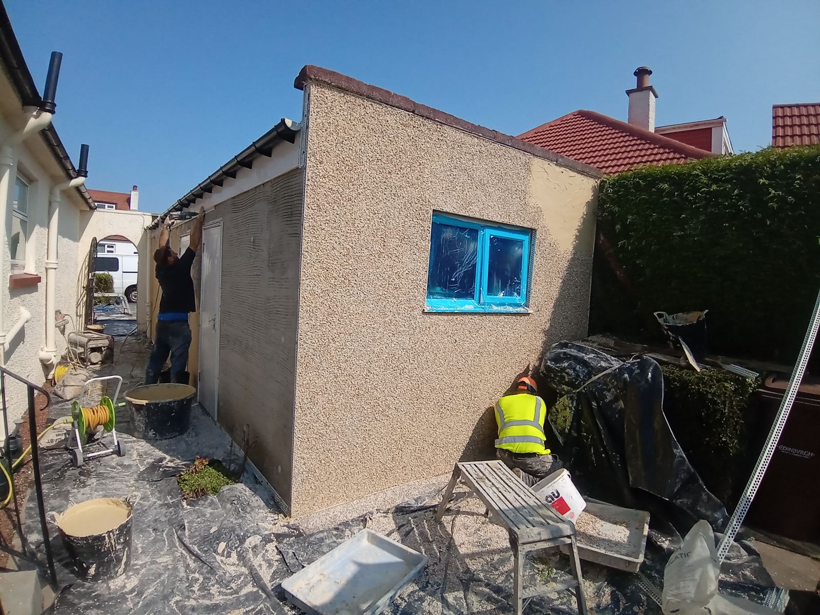rendering Edinburgh on the side of a house with visible window