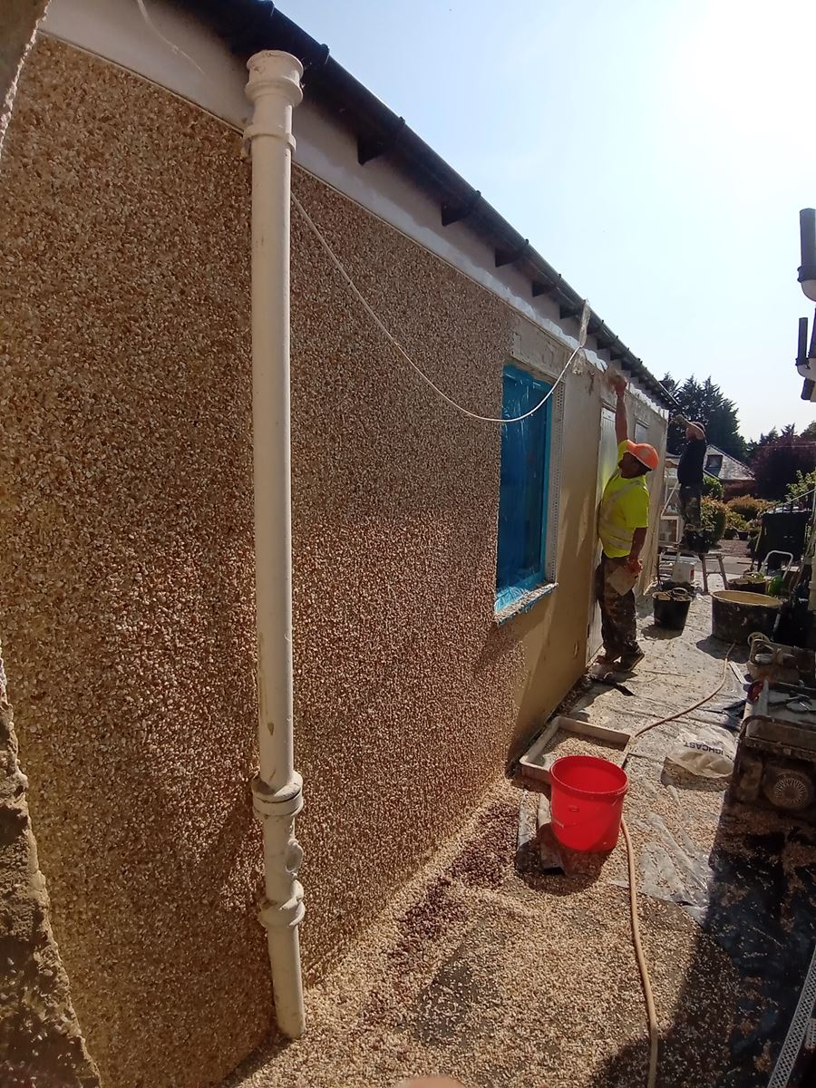 roughcast render Edinburgh applied to the exterior wall of a building with window