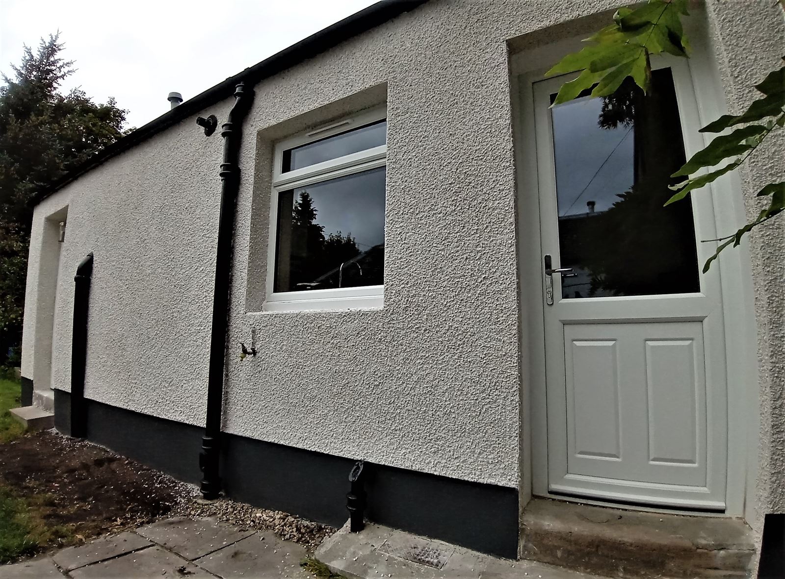 house rendering Edinburgh with a newly finished door area