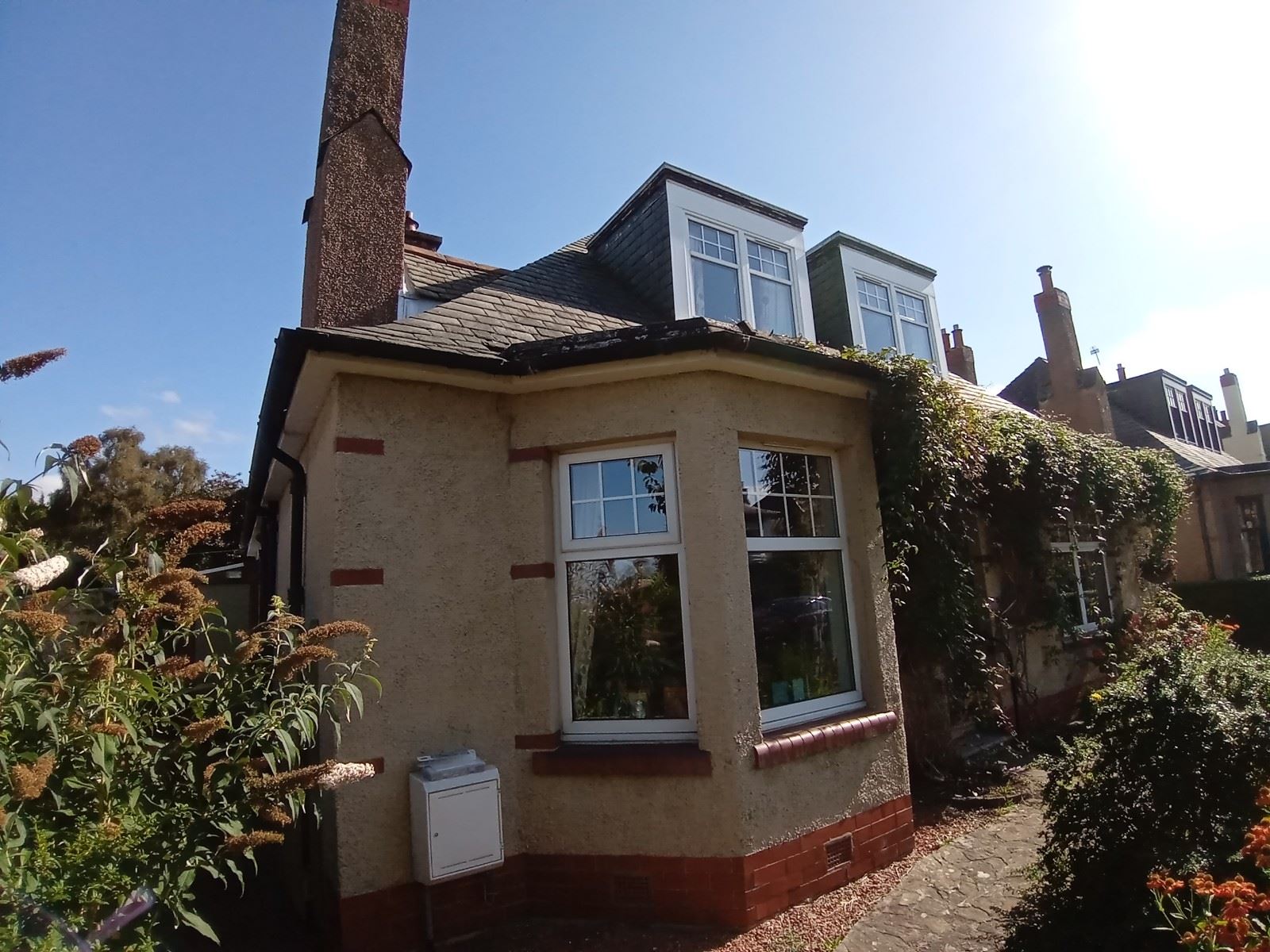 roughcasting Edinburgh near windows and exterior features