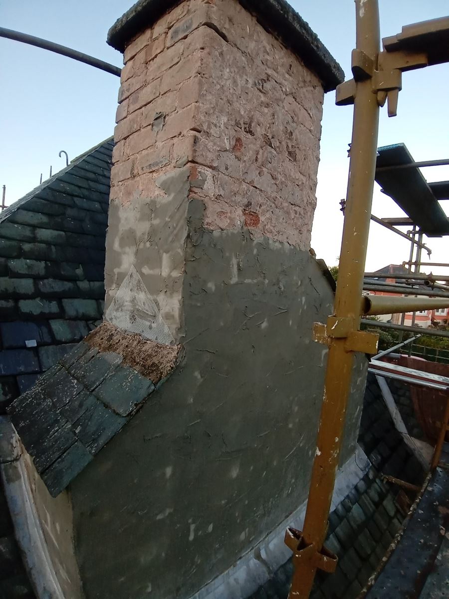 roughcast render repair on the chimney wall