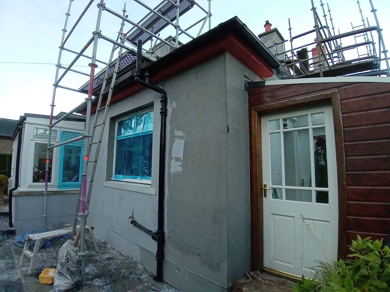 roughcast render Edinburgh applied around a house corner
