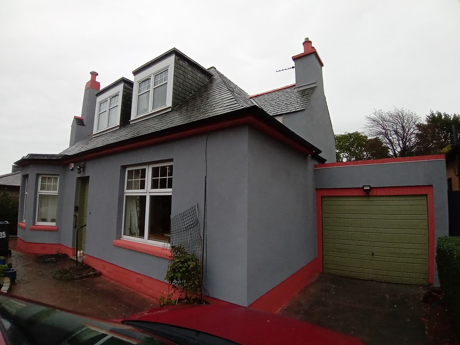 roughcast render repair in progress on a house