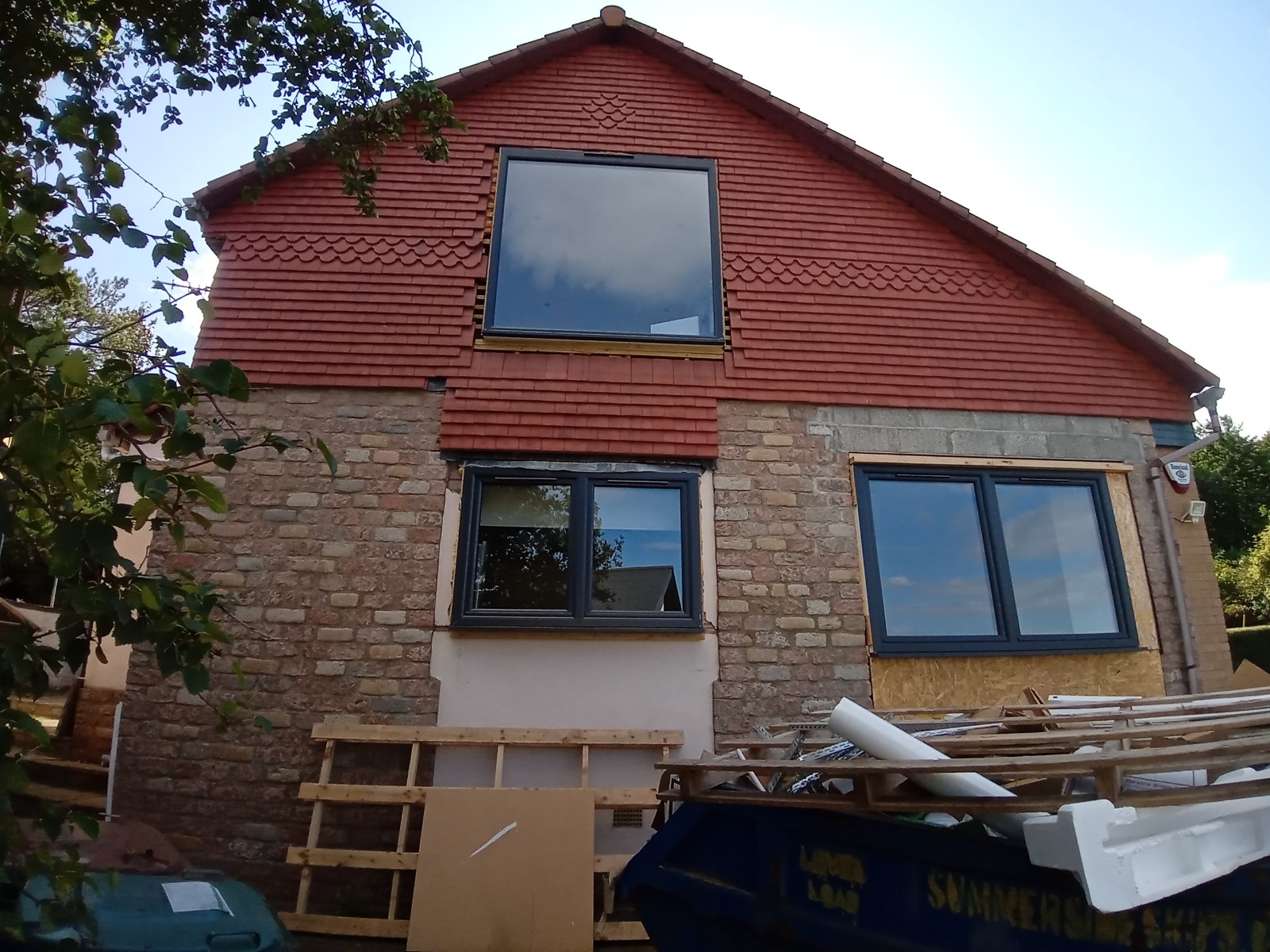 roughcast render repair being done on the house exterior