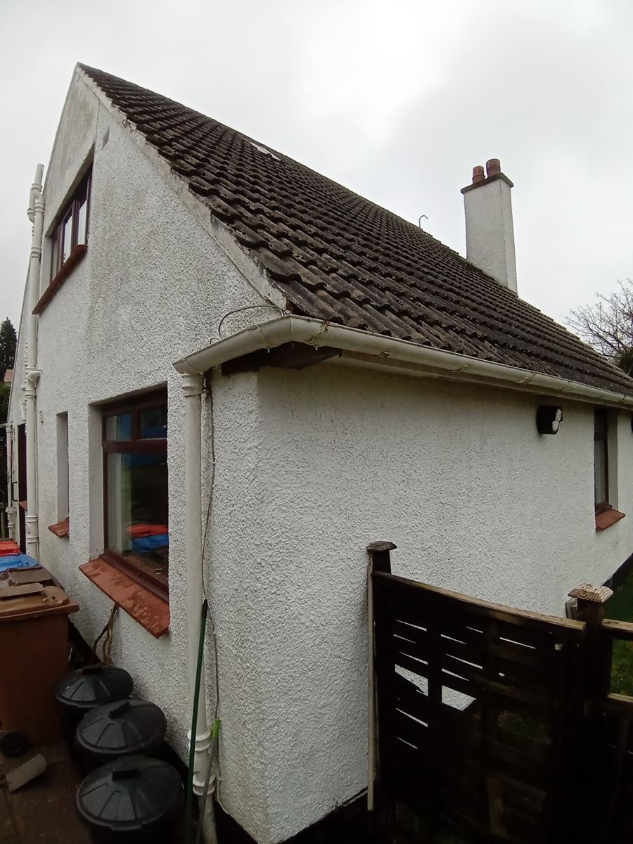 weathered facade requiring roughcast repair