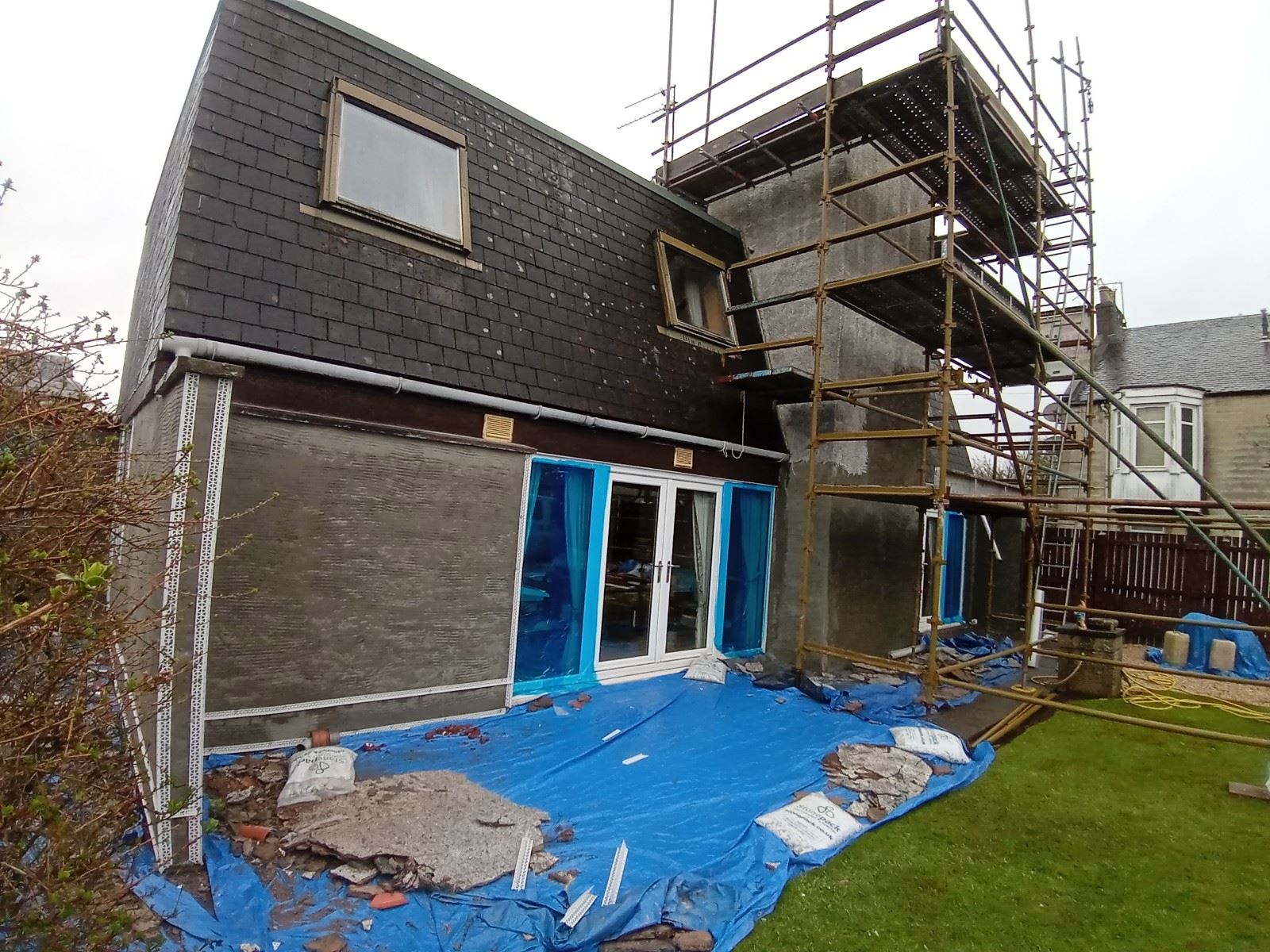 blue tarp covering solid wall insulation edinburgh