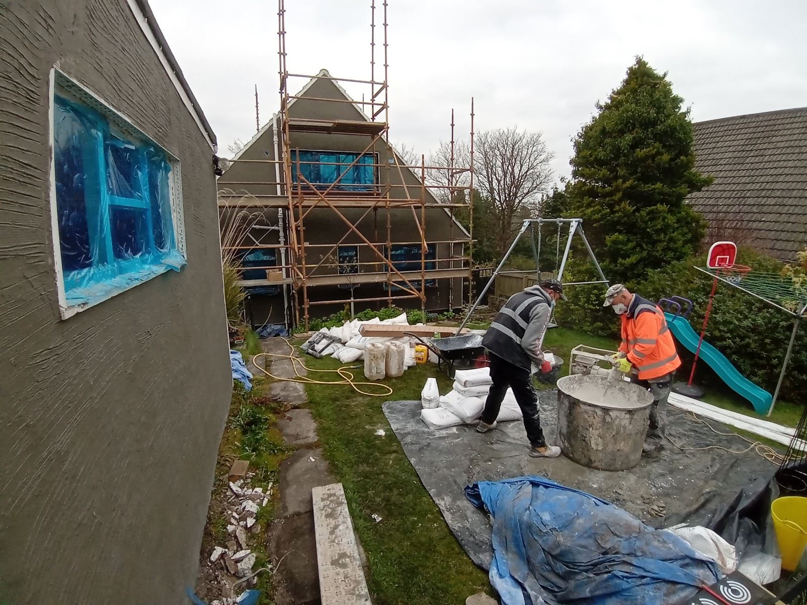 crew at scaffold, roughcast render repair