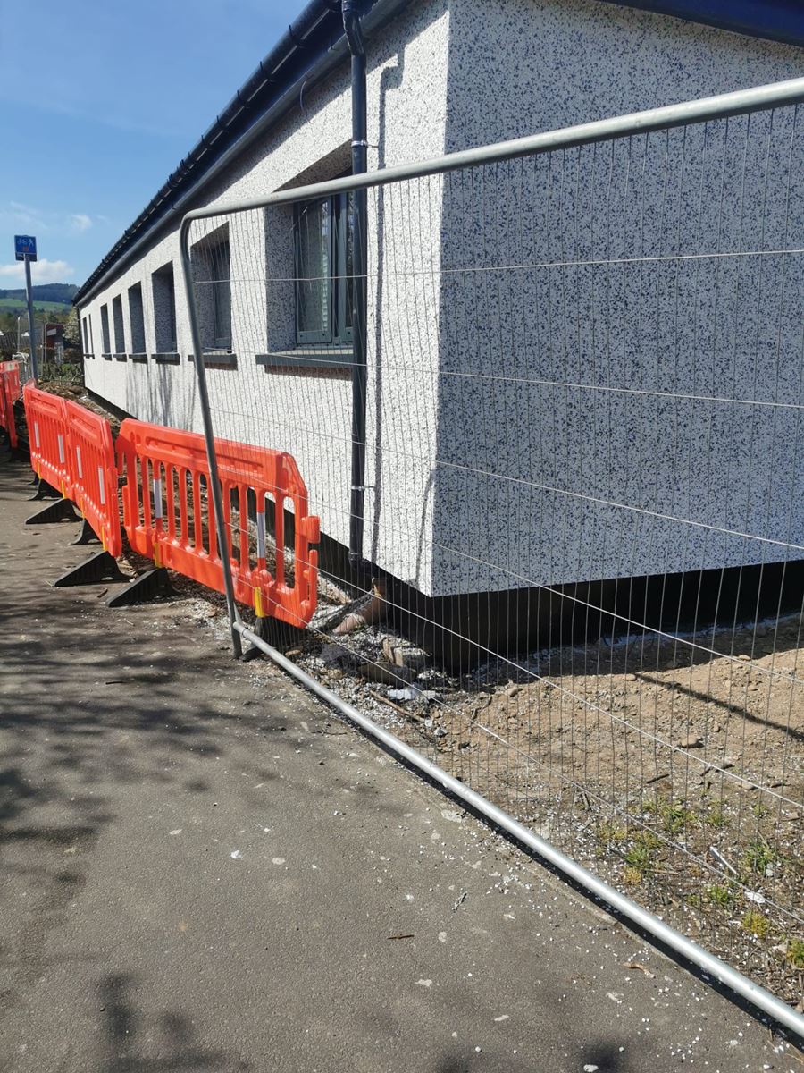 fenced construction site with roughcasting edinburgh