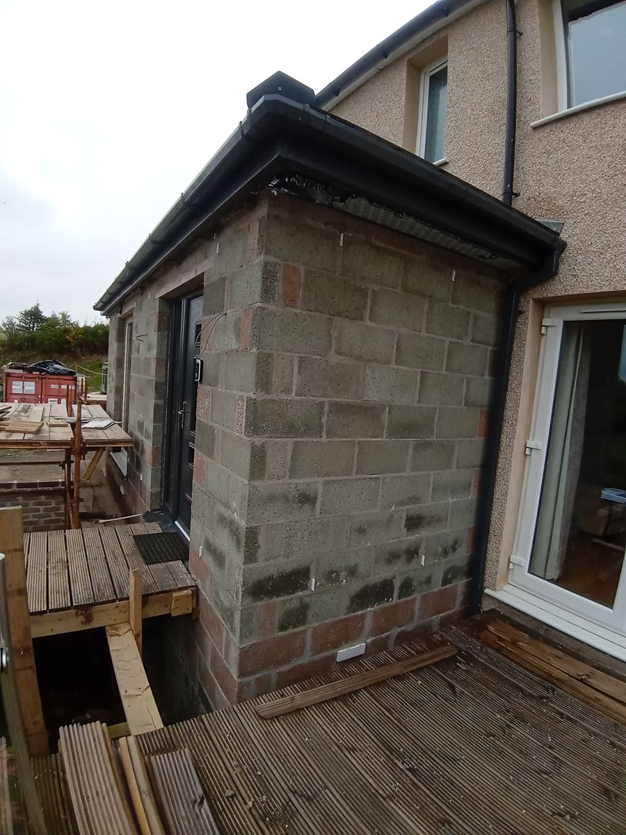 house rendering Edinburgh on side elevation with exposed blockwork