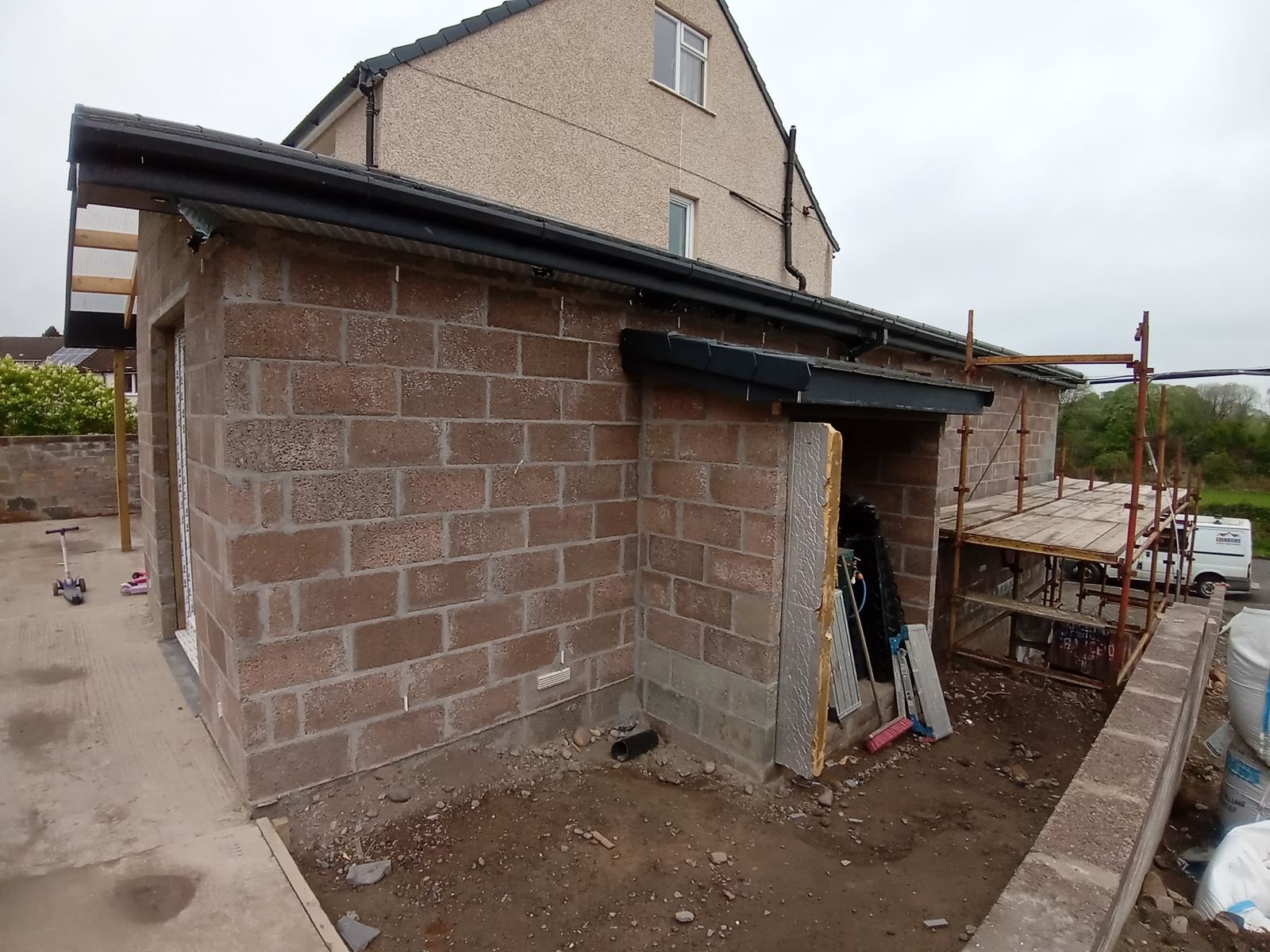 Rendering Edinburgh on rear blockwork wall under construction