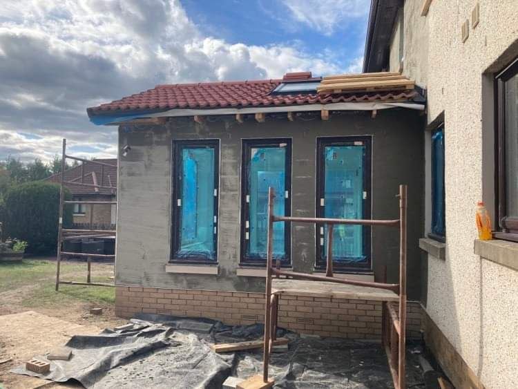 Insulation Edinburgh applied behind blue film on new extension windows