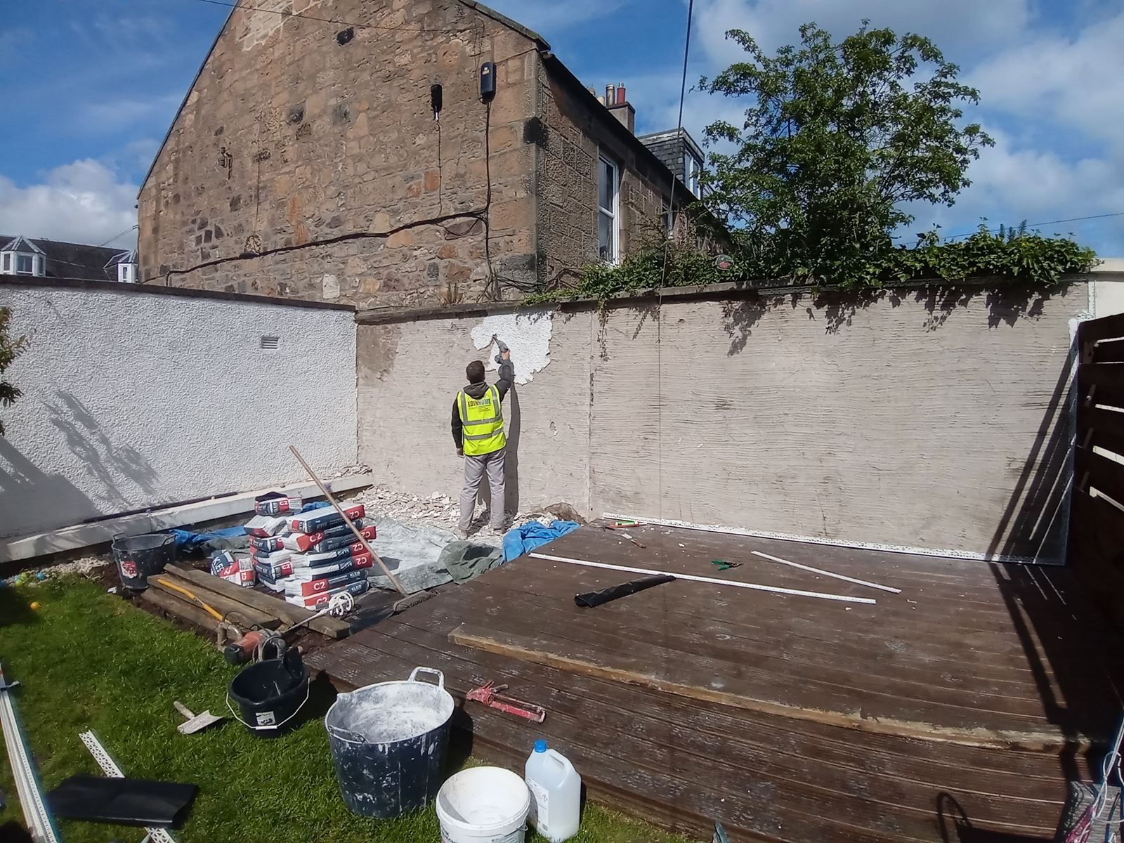 roughcast render Edinburgh on garden wall with visible shading