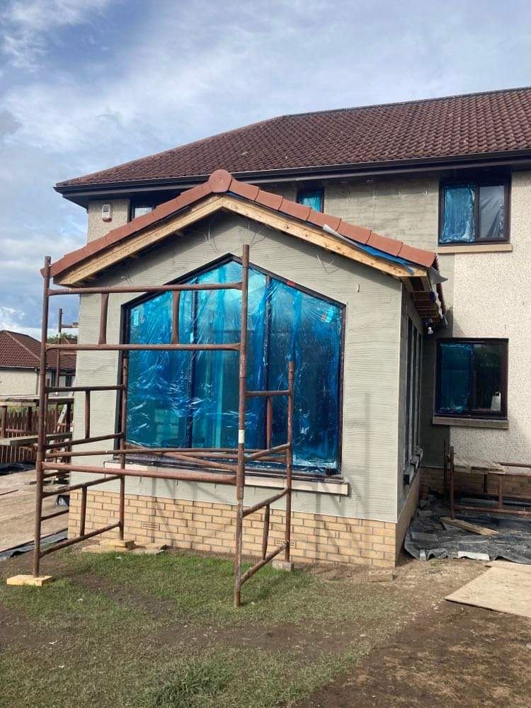 house rendering Edinburgh on bay extension wall under scaffolding