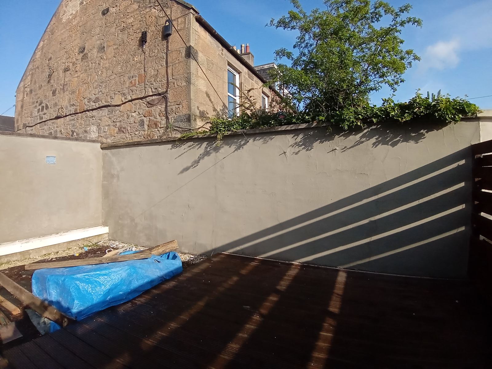 roughcasting Edinburgh on freshly finished white boundary wall