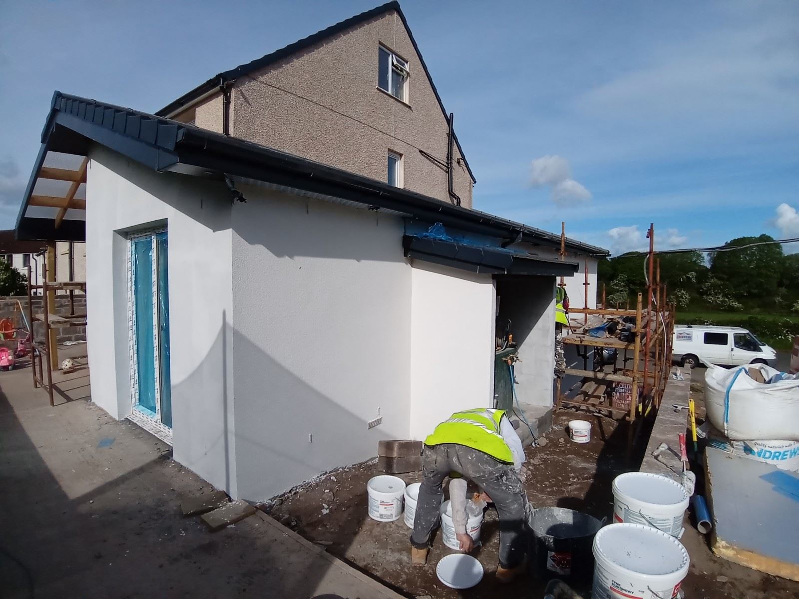 house rendering Edinburgh on plain white side wall