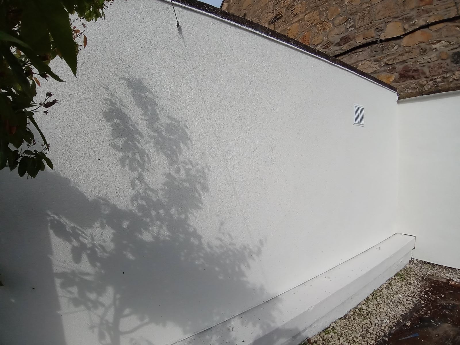 solid wall insulation Edinburgh with sunlight shadow on new façade