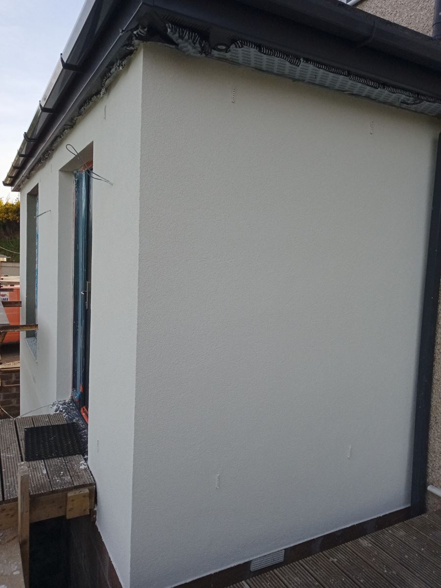 Rendering Edinburgh on extension wall with scaffold and blue coverings