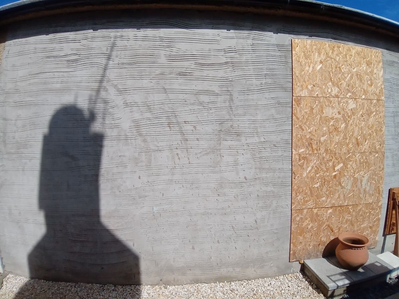 roughcast repair on wall after application of fresh base coat