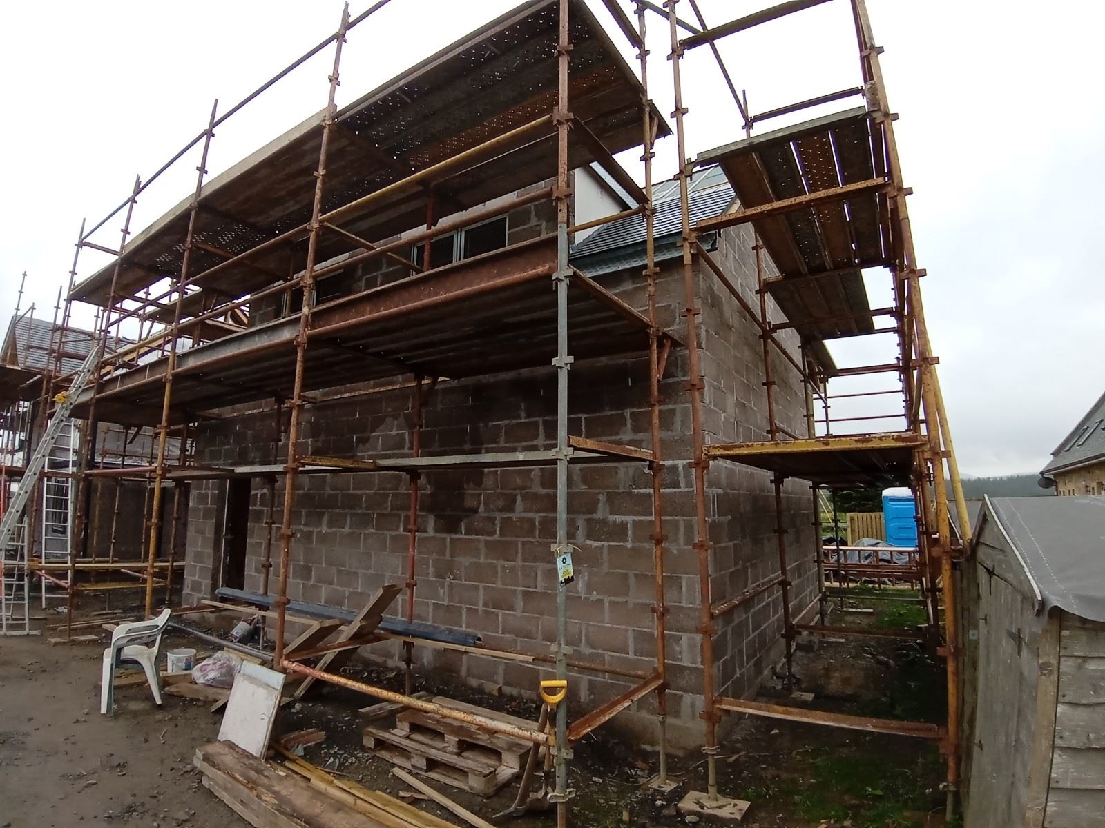 external wall insulation Edinburgh on front home wall under scaffolding