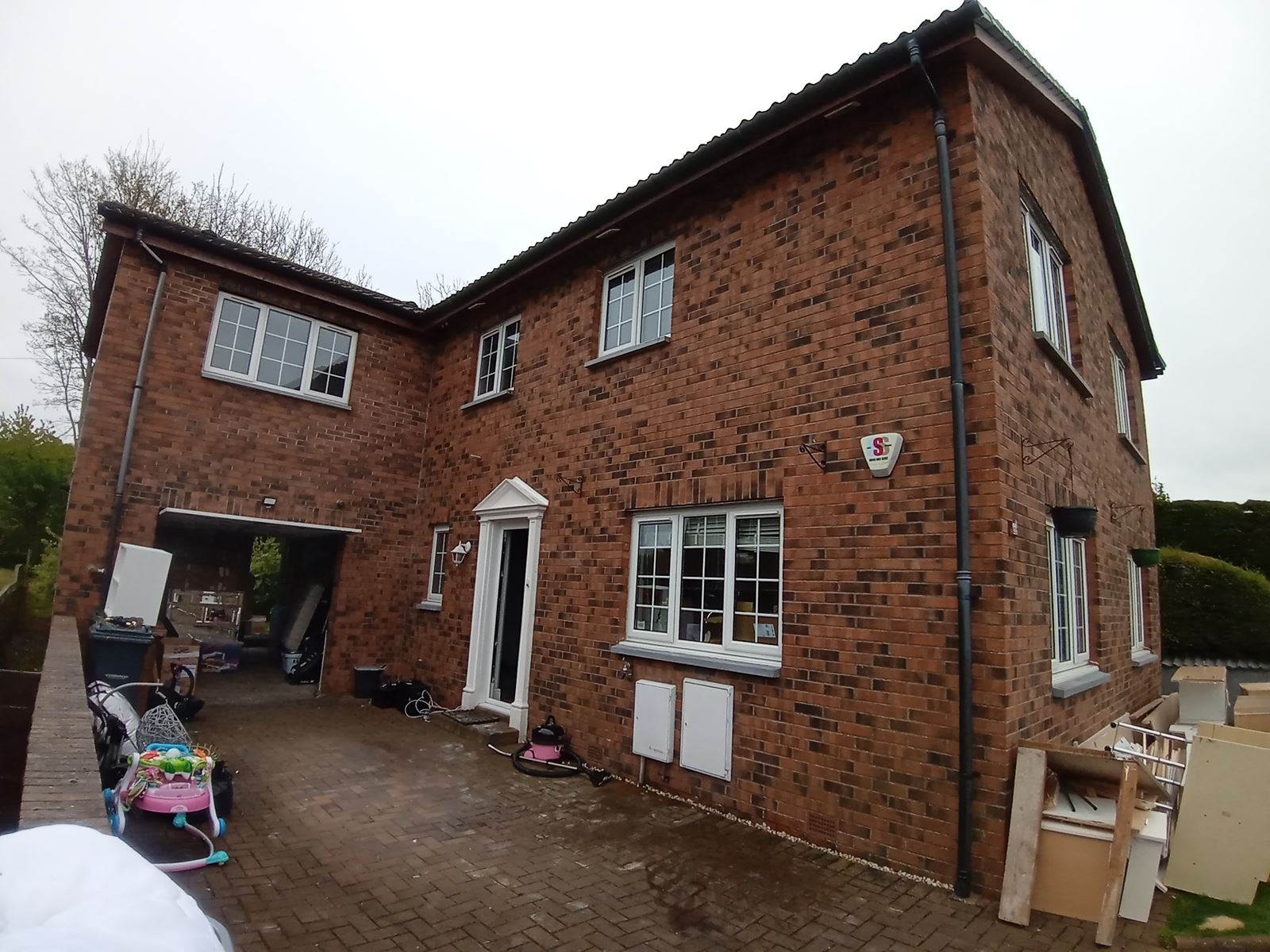 roughcast render Edinburgh on side elevation with driveway and entrance