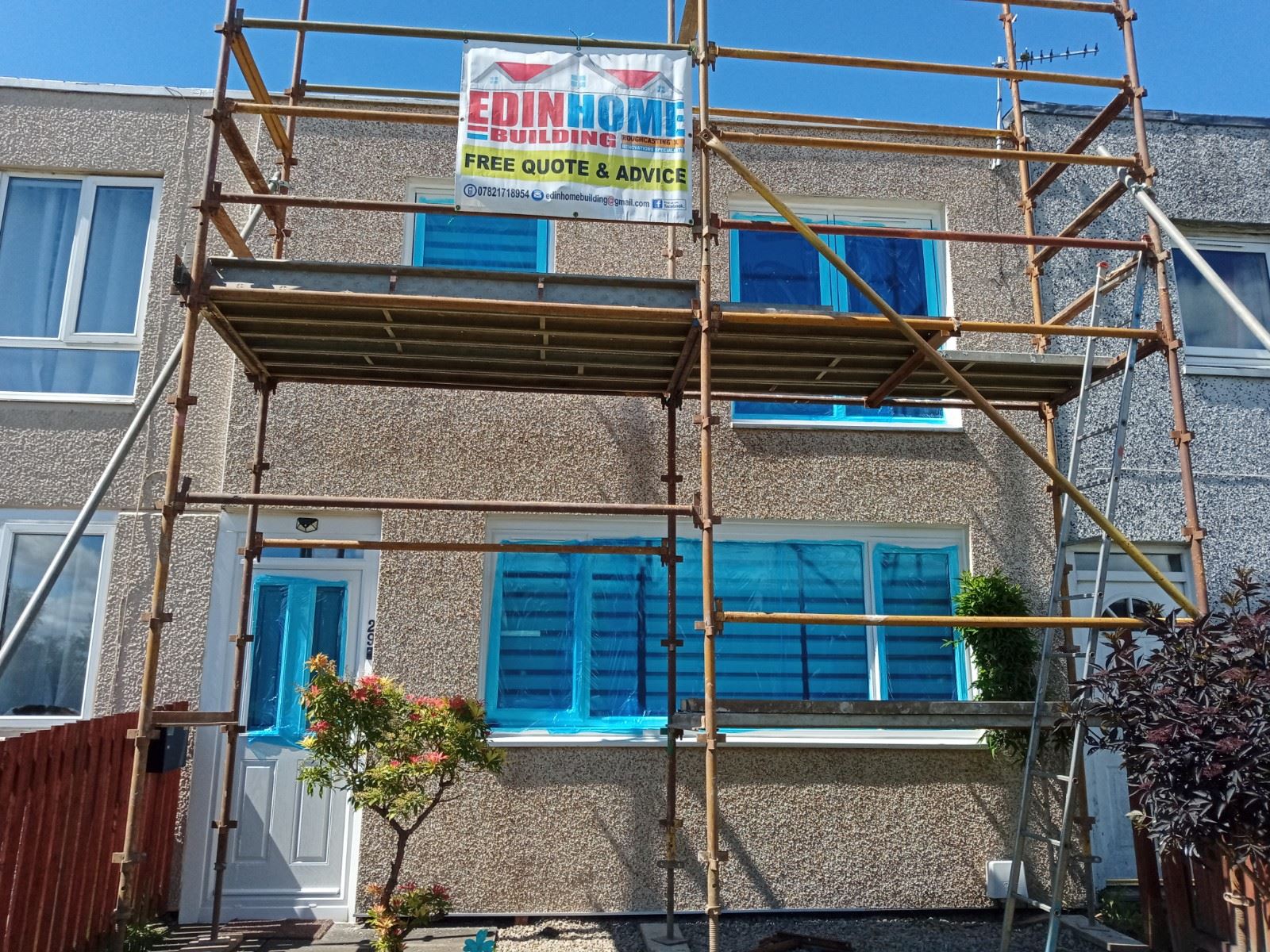 Insulation Edinburgh beneath render at entrance under scaffold