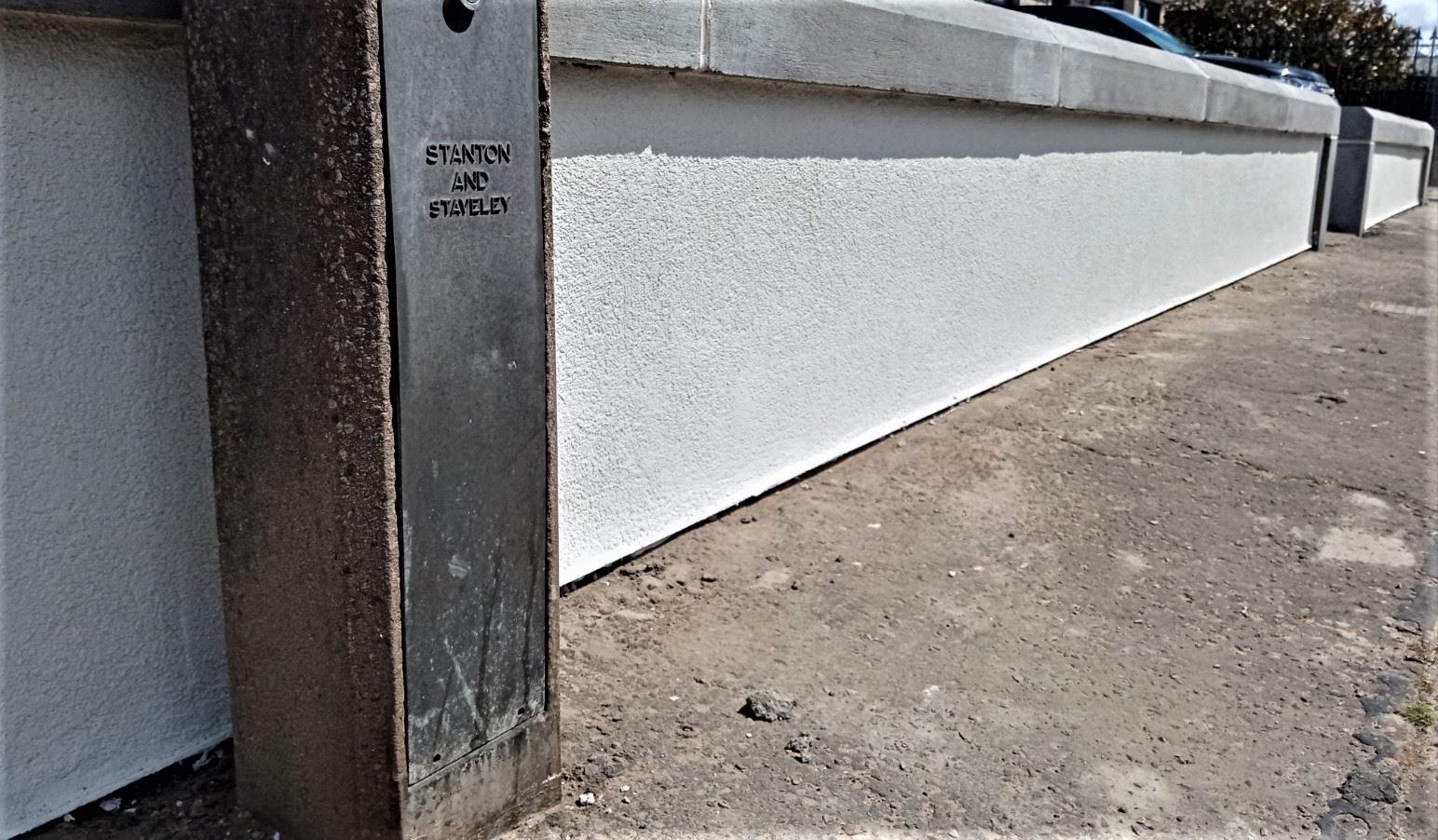roughcast repair on wall section with smooth base finish