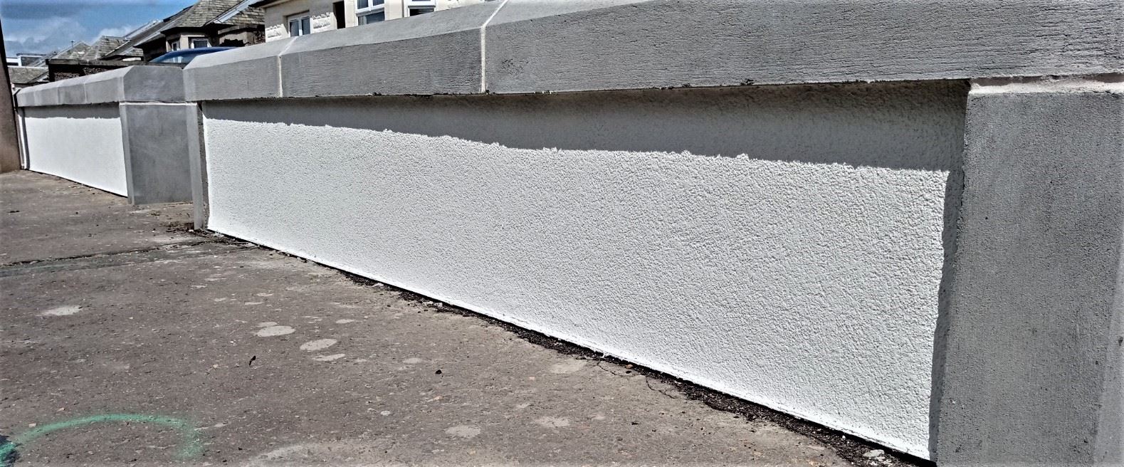 roughcasting Edinburgh on fresh white boundary wall surface