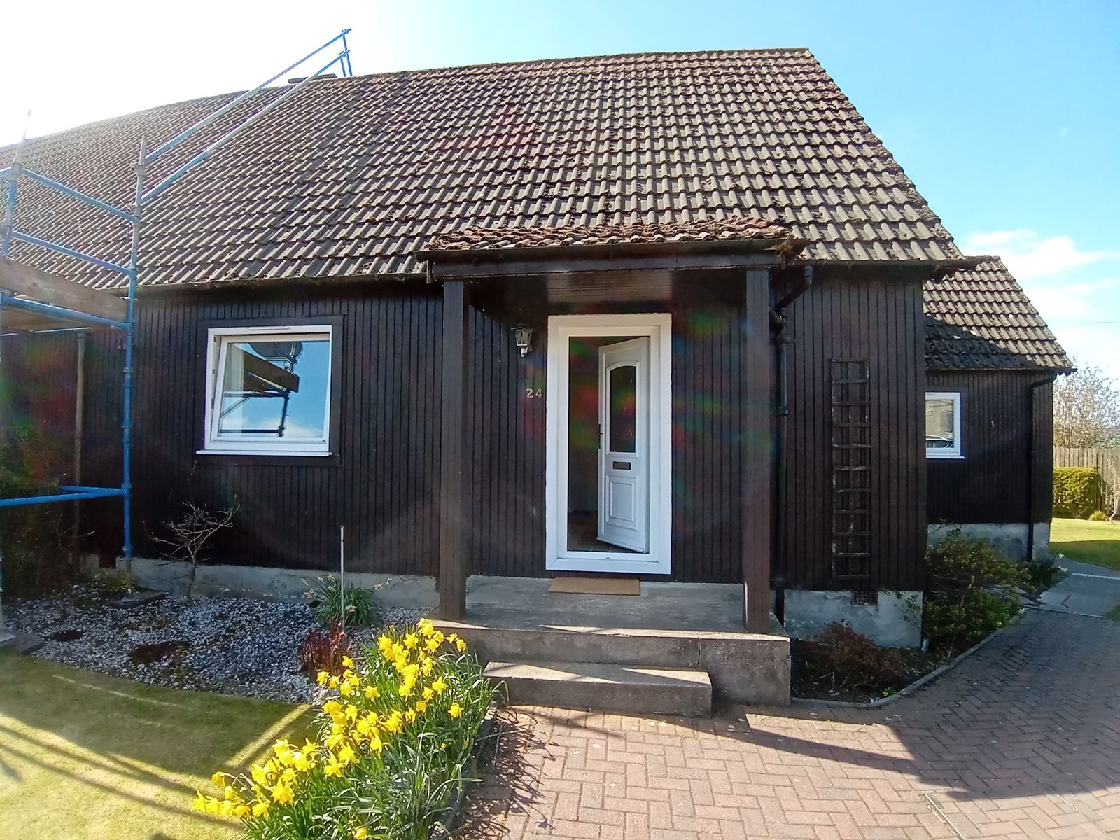solid wall insulation Edinburgh finished on front elevation with white door