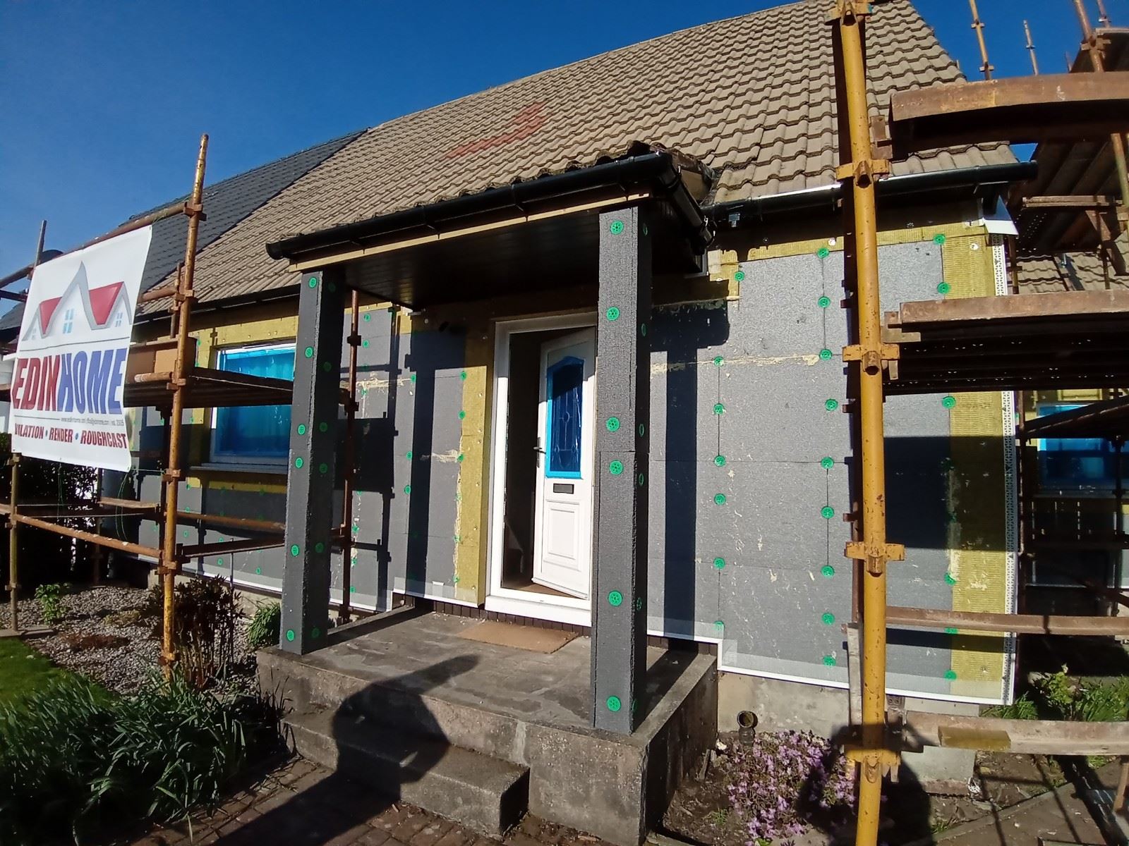 roughcast render repair on front porch wall ready for finishing coat