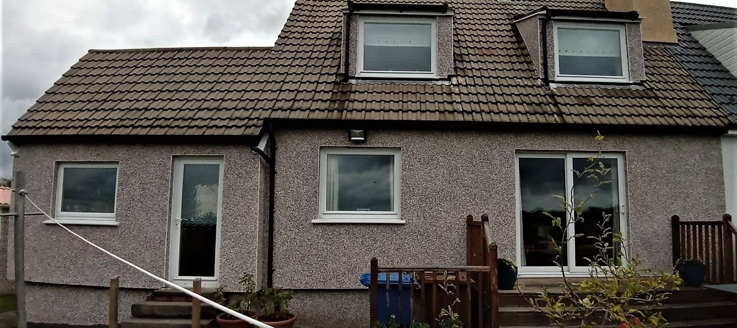roughcasting Edinburgh on rear house wall with upper dormer window