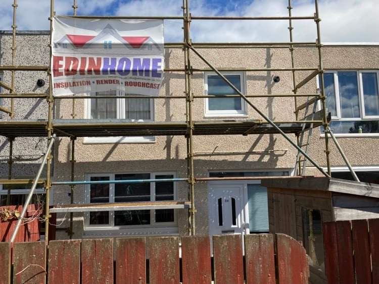 roughcast render repair on wall with entrance door under scatterproof