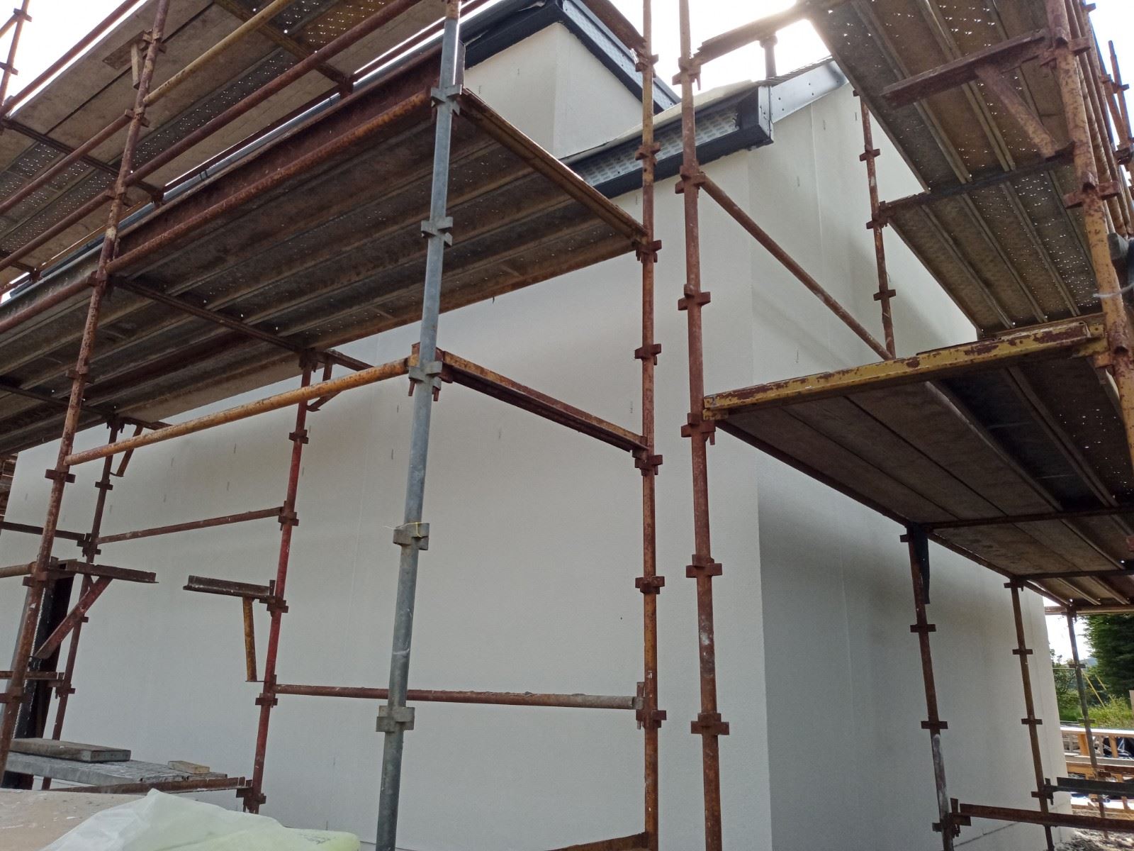 house rendering Edinburgh on upper wall area undergoing repair